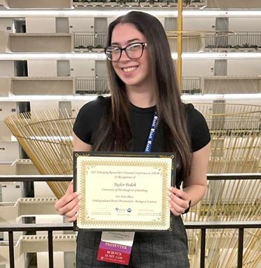 Taylor Podob receibed a certificate of achievement